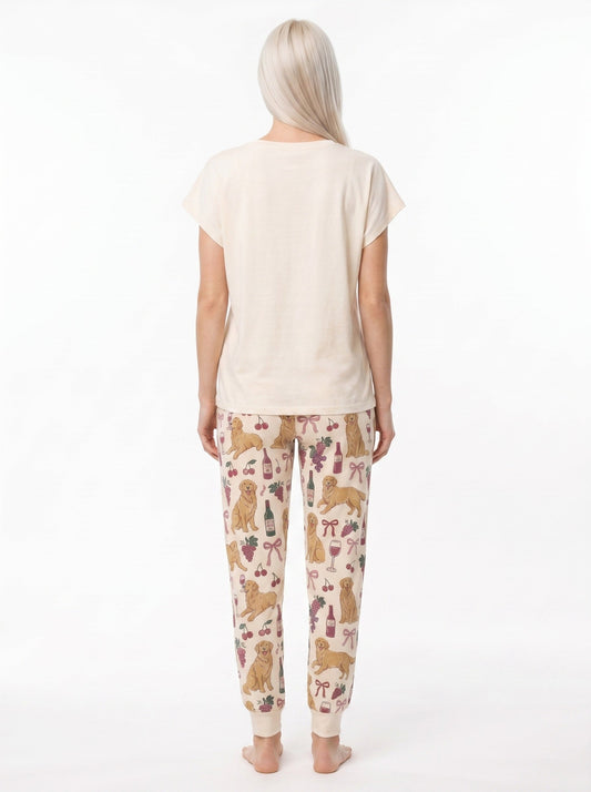 Women's soft knit pajama set with golden retriever wine graphic tee and all-over print jogger pants, cream and dusty rose palette